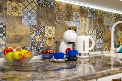 a kitchen with a counter with bowls of fruit on it at Casa Marincheshki in Orizari - 6км to Plovdiv in Orizari