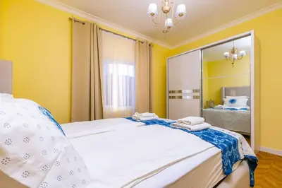 a bedroom with a large mirror and a bed at Casa Marincheshki in Orizari - 6км to Plovdiv in Orizari