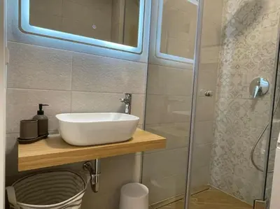a bathroom with a sink and a shower at Via421 by COSHER in Sofia