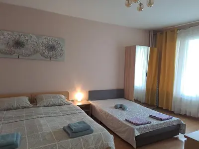 a bedroom with two beds with towels on them at LevskiG Studio 10 min from Sofia Airport and city centre in Sofia