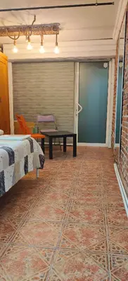 a room with a bed and a table and a couch at Artistic Atelier, Top Center - Vitosha Blvd in Sofia