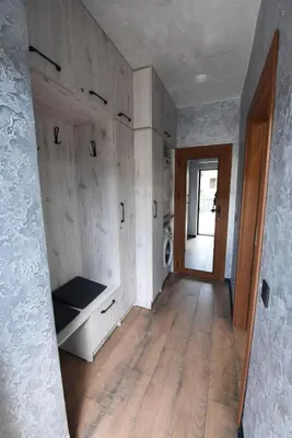 a hallway of a house with a laundry room and a door at Студио Анастасия in Smolyan