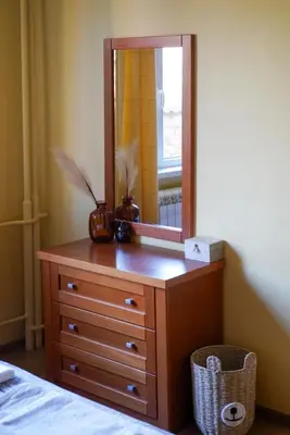 a dresser with a mirror on top of it at Oborishte Family Elegance with Garden View in Sofia