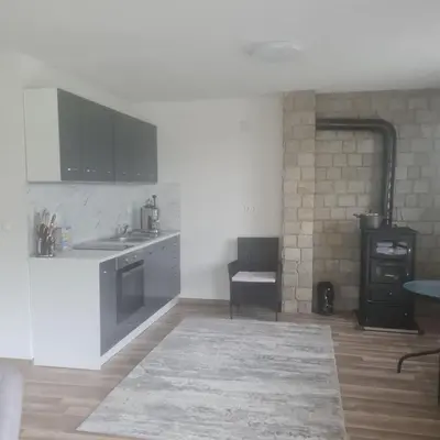 a kitchen with a sink and a counter top at Вила Хадживезула in Yokoruda