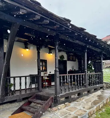 a wooden gazebo in a yard with at Туйковата къща The Tuikov House in Teteven