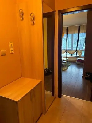 a room with a mirror and a room with a hallway at Luxury Apartment Bansko in Bansko