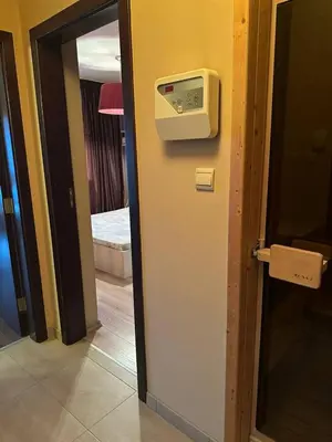 a door to a room with a paper towel dispenser at Luxury Apartment Bansko in Bansko
