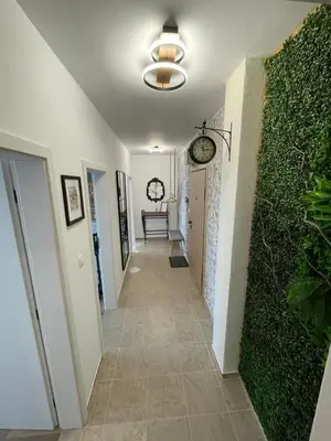 a hallway of a house with a green wall at Platinum Luxury Industrial Unit City-Center in Plovdiv