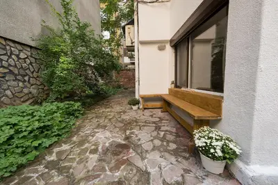 a window with a bench next to a building at Stylish apartment, Top center! in Sofia