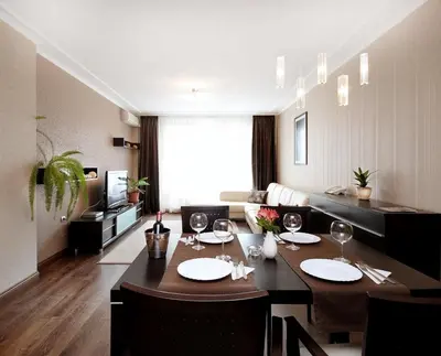 a living room with a dining table with wine glasses at Apartments Carrera in Sofia