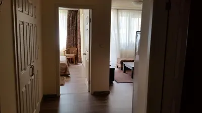 a hallway with a door open to a living room at Apartments Carrera in Sofia