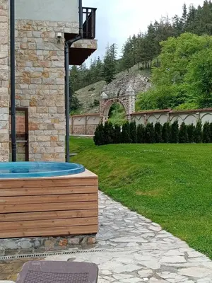 a backyard with a hot tub in a yard at Apartment in Hotel Sveti Spas 5 Velingrad in Velingrad
