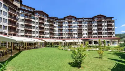 a large building with a large lawn in front of it at Apartment in Hotel Sveti Spas 5 Velingrad in Velingrad