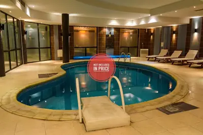 a swimming pool with a no entry sign in a hotel at Dream 1BRoom Private Apartment in Bansko