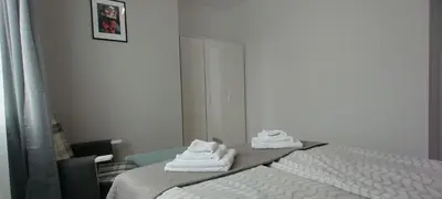 two towels sitting on a bed in a room at O pulse Sofia apartment in Sofia