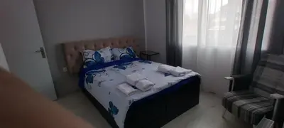 a bedroom with a bed with towels on it at O pulse Sofia apartment in Sofia
