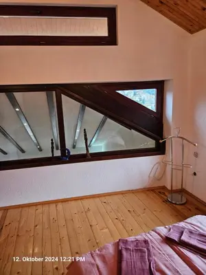 a room with a large window in a bedroom at Villa Dilyanka Stokite in Stoykite