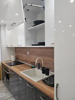 a kitchen with a sink and a counter top at Boutique apartment yellow 1 in Plovdiv