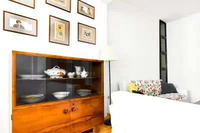 a living room with a cabinet filled with dishes at Prime Spot - 2BR -15BTH - Next to Nevsky Church in Sofia