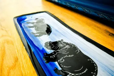 a cake with a black bear on top of a table at Work Friendly 2BR AC Terrace Str Parking in Sofia