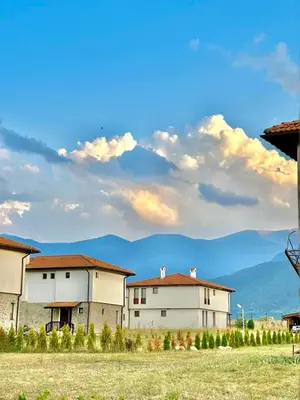 a group of buildings with mountains in the background at Villa Vista in Dolna Banya