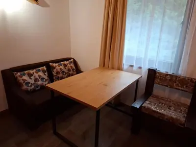 a table and two chairs in a room with a window at Horlog Castle in Trigrad