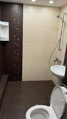 a bathroom with a toilet and a sink at Astoriq in Sofia
