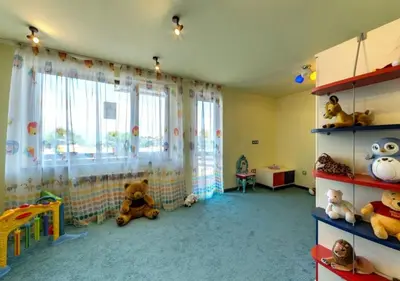 a childs room with stuffed animals in a room with a window at Deluxe Apartment In Belvedere With Terrace in Bansko