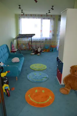 a living room with a couch and a teddy bear at Deluxe Apartment In Belvedere With Terrace in Bansko