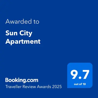 a blue screen with the text awarded to sun city apartment at Sun City Apartment in Sandanski