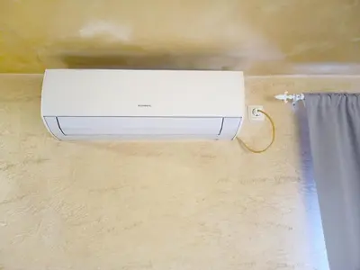 a white heater on a wall with a curtain at Apartment Lion's bridge 2 - Top Center in Sofia