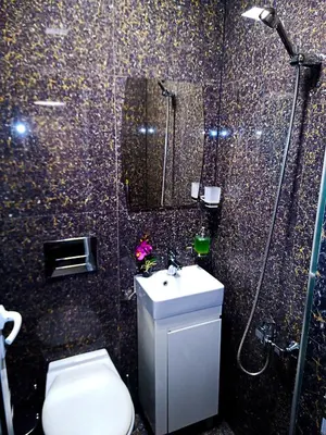 a bathroom with a toilet and a shower and a sink at Apartment Lion's bridge 2 - Top Center in Sofia