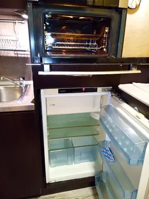 an empty refrigerator with its door open in a kitchen at Apartment Lion's bridge 2 - Top Center in Sofia