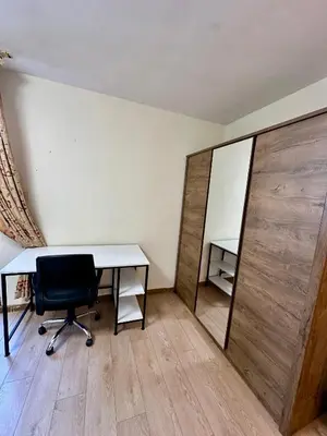 an office with a desk and a chair and a mirror at Central District 3 Bedroom Place in Plovdiv