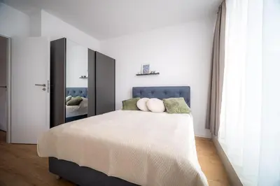 a bedroom with a large bed with a large mirror at My Campus 1 bdrm, Mountain view, Free parking, Self check-in in Sofia