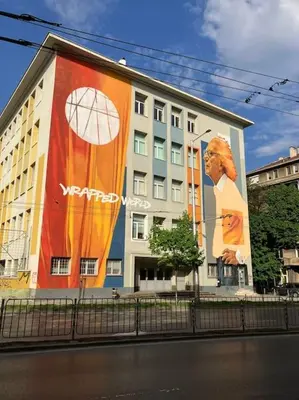 a building with a large advertisement on the side of it at Modern and Calm 2BDRM Apt in City Centre in Sofia