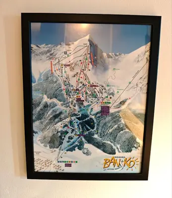 a framed picture of a mountain with snow at Friendly apartment -top location in Bansko