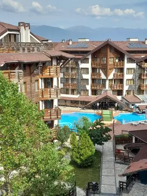 a view of a hotel with two swimming pools at Belvedere Holiday Club H80 in Bansko