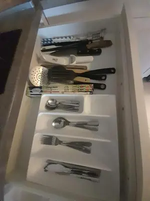a drawer filled with lots of kitchen utensils at Belvedere Holiday Club H80 in Bansko