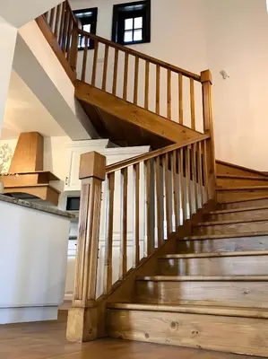 a wooden staircase in a house with wooden floors at Large Cosy House by a Forest - Treehouse, BBQ, Fireplace & Mountain in Sopot