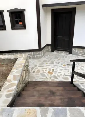 a house with a door and a stone walkway at Large Cosy House by a Forest - Treehouse, BBQ, Fireplace & Mountain in Sopot