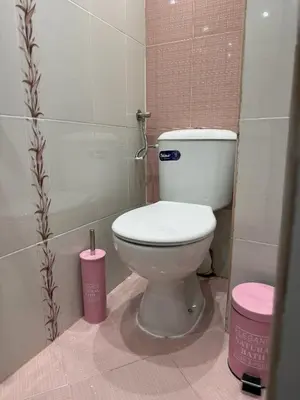 a bathroom with a white toilet in a stall at Central Art Studio in Sofia