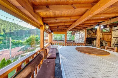 a large room with a view of a mountain at Valkanovi House in Pamporovo