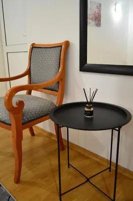 a chair and a table and a chair and a table and a chair at TOP Center, basement fl, 7 beds, 10min from Serdica in Sofia