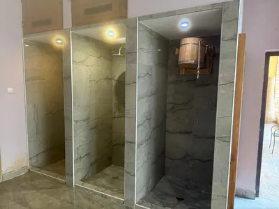 a walk in shower with a glass door at Мия4 Спа хотел Свети Спас in Velingrad