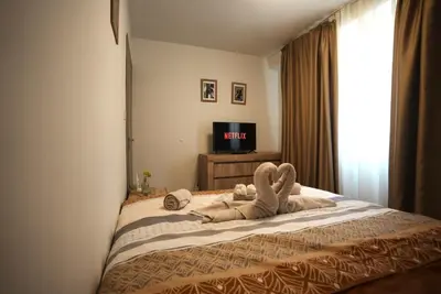 a stuffed animal is laying on a bed at The Secret Paradise in Sofia