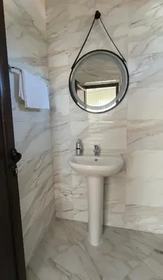 a bathroom with a sink and a mirror at Къща за гости Етерна - Guest house Eterna in Starosel