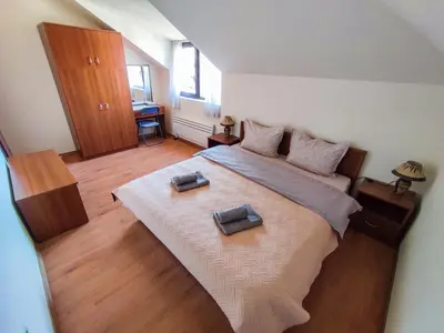 a bedroom with a large bed with two towels on it at 