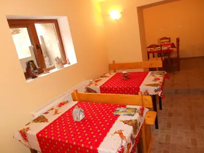 a room with two beds in a room at Guest House Tsenovi in Koprivshtitsa
