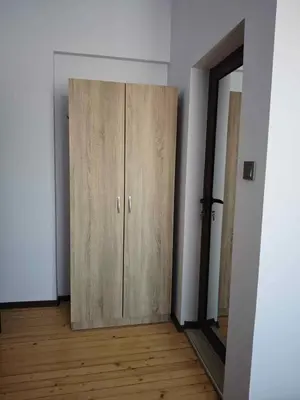 a wooden cabinet in a room with a mirror at Къща за гости Савана, Пловдив,Plovdiv, летище Пловдив, Plovdiv Airport,Ягодово in Yagodovo
